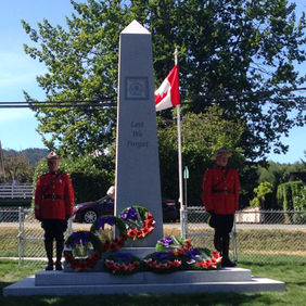 Two guards stand by Canadian war memorial with wreaths, Civic Monuments.