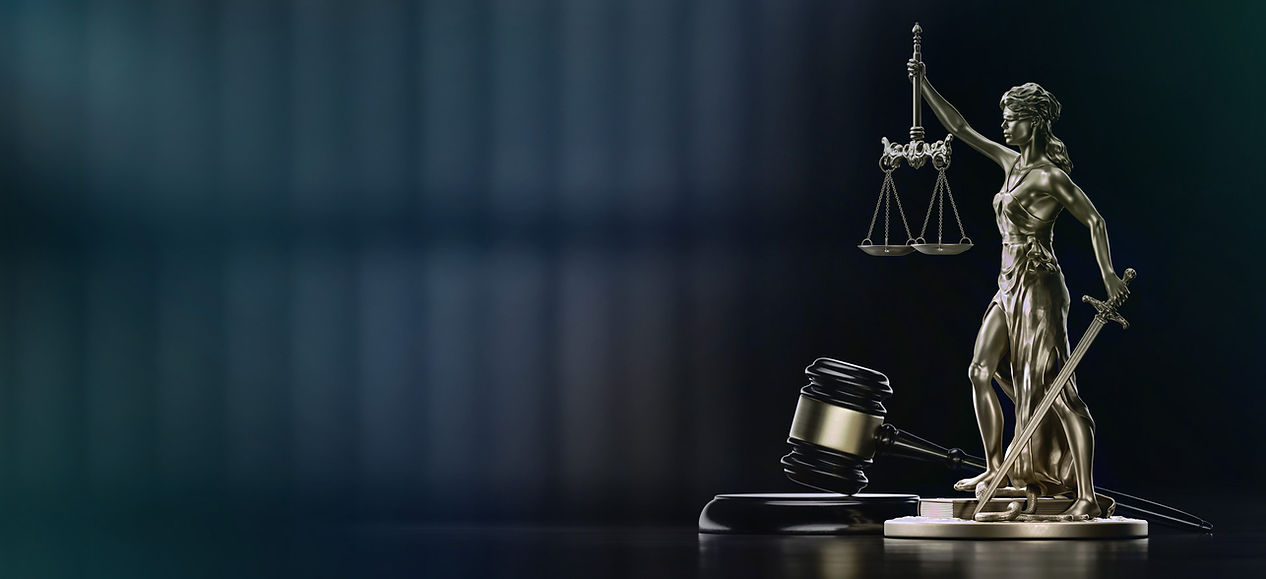 Lady Justice statue with scales, sword, and gavel