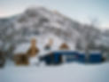 House with Steve's Insulation LLC sign, snowy mountains