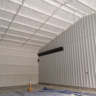 Spray foam insulation in a warehouse interior