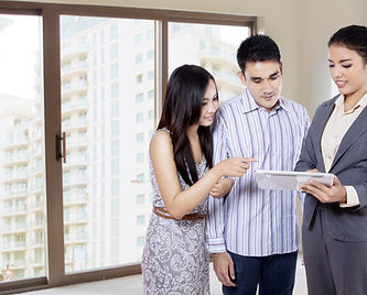 Couple discussing documents with an advisor