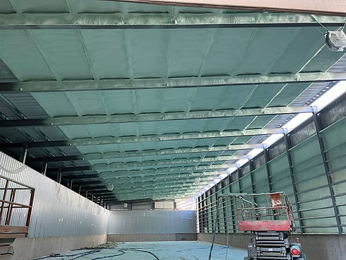 Spray foam insulation applied to a building ceiling
