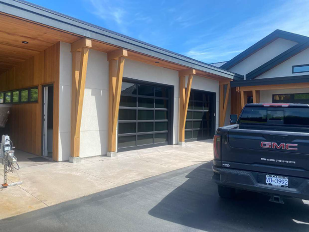 Modern commercial garage with glass doors and wood beams