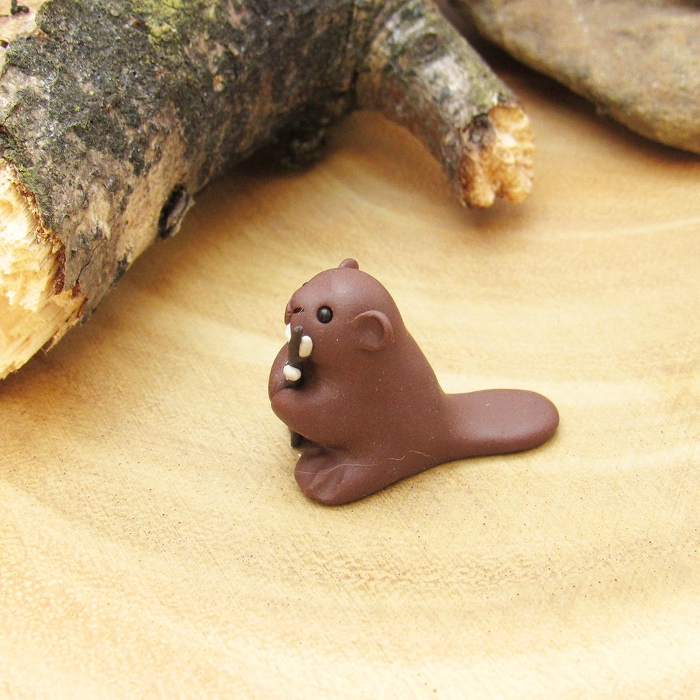Thumbnail: Tiny beaver ornament with willow branch side view