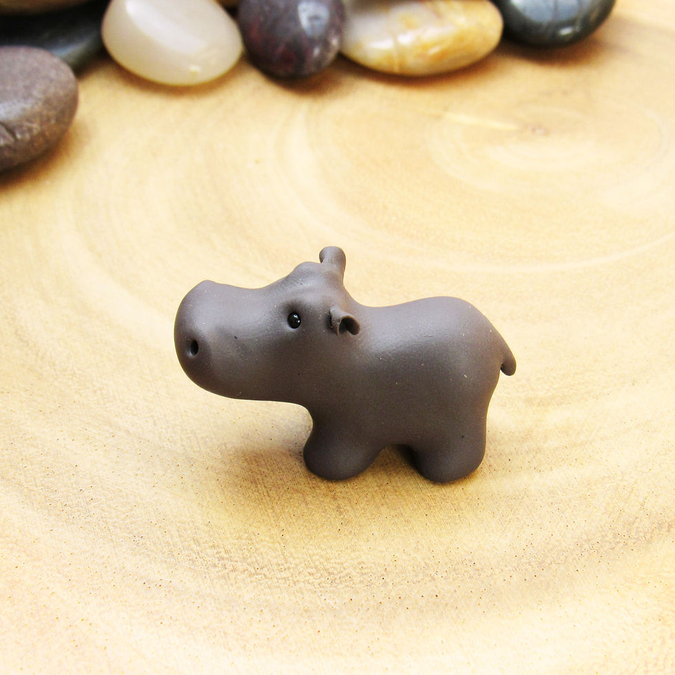 Thumbnail: Tiny hippo ornament made from polymer clay side view