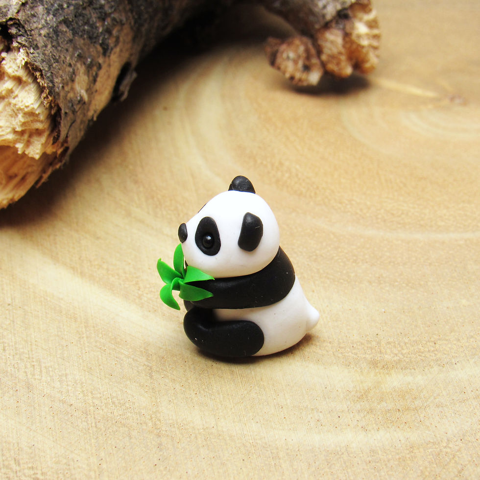 Thumbnail: Tiny giant panda ornament with bamboo side view