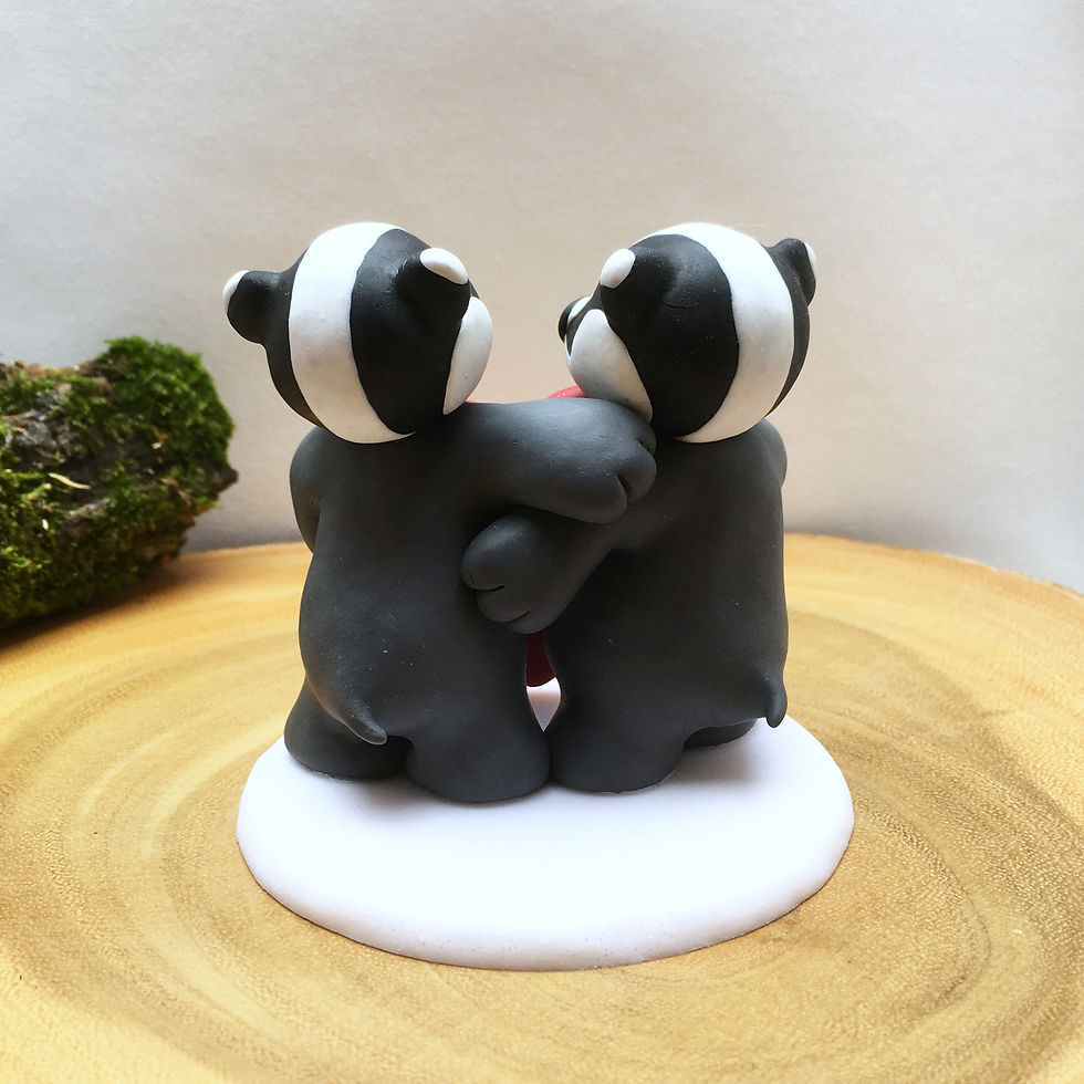 Thumbnail: Badgers with heart wedding cake topper