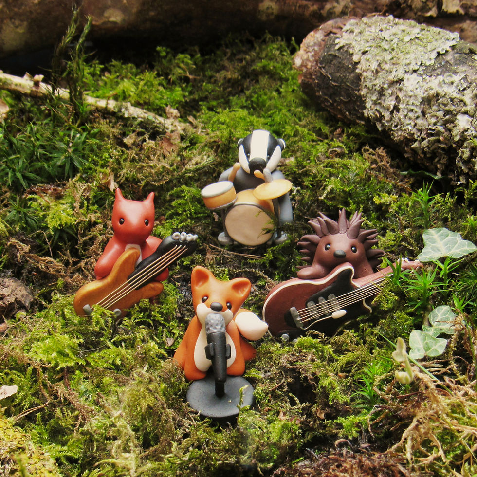 Woodland rock band with singing fox, lead guitar playing hedgehog, bass guitar playing red squirrel and drum playing badger