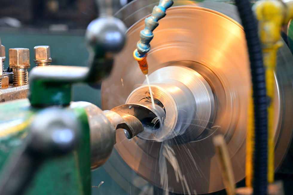 A hydraulic cylinder component being precision-machined on a rotating lathe.