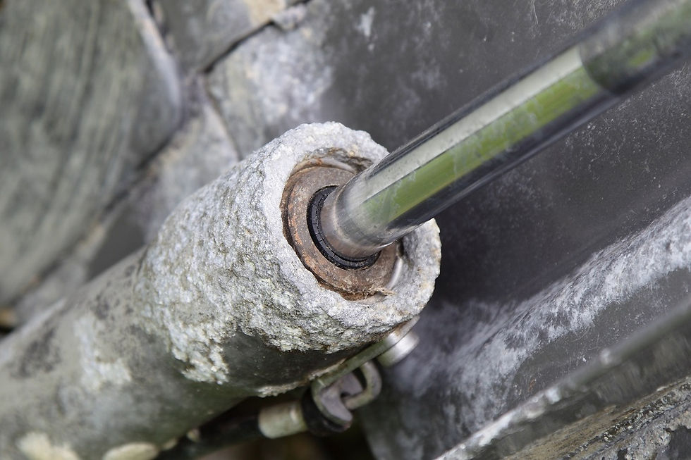 Close-up of a hydraulic cylinder with corrosion buildup around the seals.