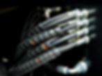 Custom hydraulic hoses with spiral wrap and precision fittings for industrial use