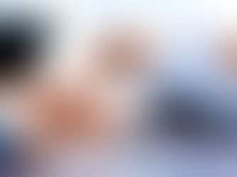 Close-up of two professionals reviewing papers with pens in hand, representing leadership promotions and candidate evaluation.