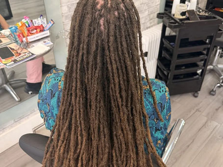 Client with long healthy locs.