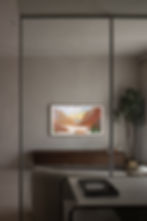 Modern living room with a mountain landscape painting on the wall. Neutral tones, a potted plant, and a table with a book create a calm ambiance.
