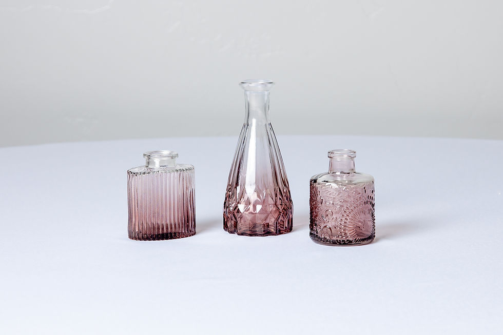 Thumbnail: Purple-toned bud vases in soft glass with a mix of geometric and classic silhouettes.