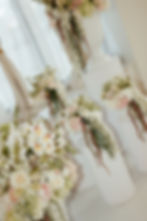 Thumbnail: Romance in Bloom wedding floral arrangements with cascading greenery from Jubilate Rentals in Utah
