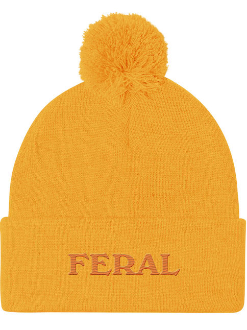 Pom-pom beanie embroidered with the word ‘Feral.’ Cute chaotic winter hat.