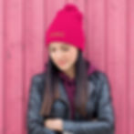 Pom-pom beanie embroidered with the word ‘Iconic’ on the cuff. Statement winter accessory.