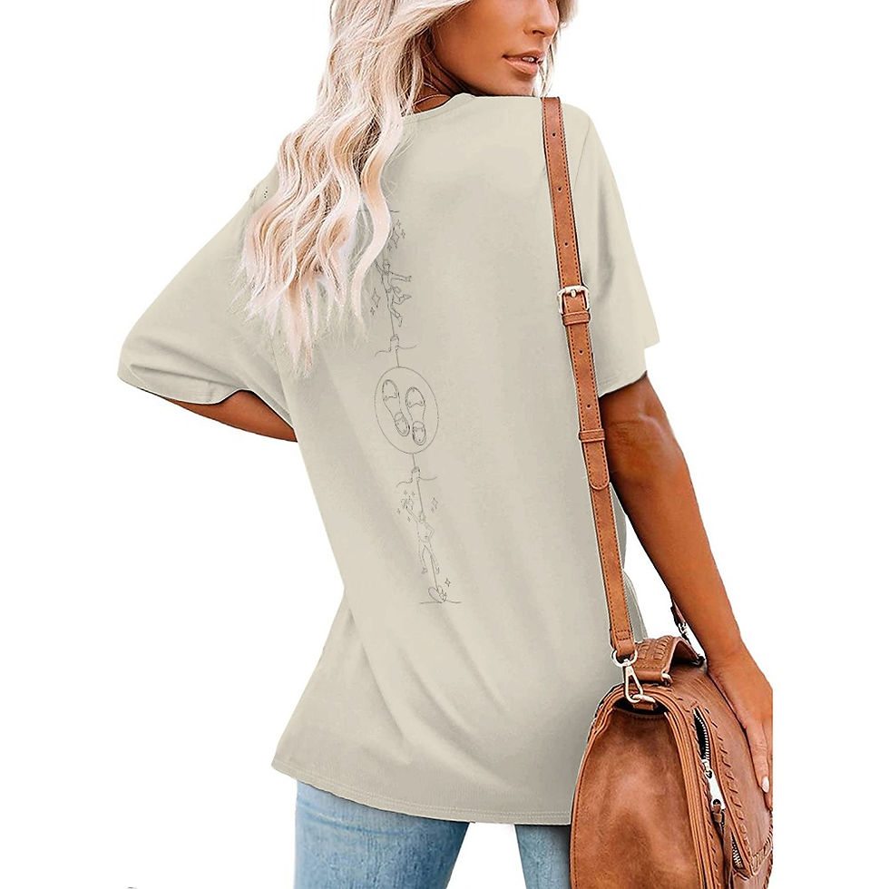 Thumbnail: Model wearing beige Tappers T-shirt styled casually with handbag