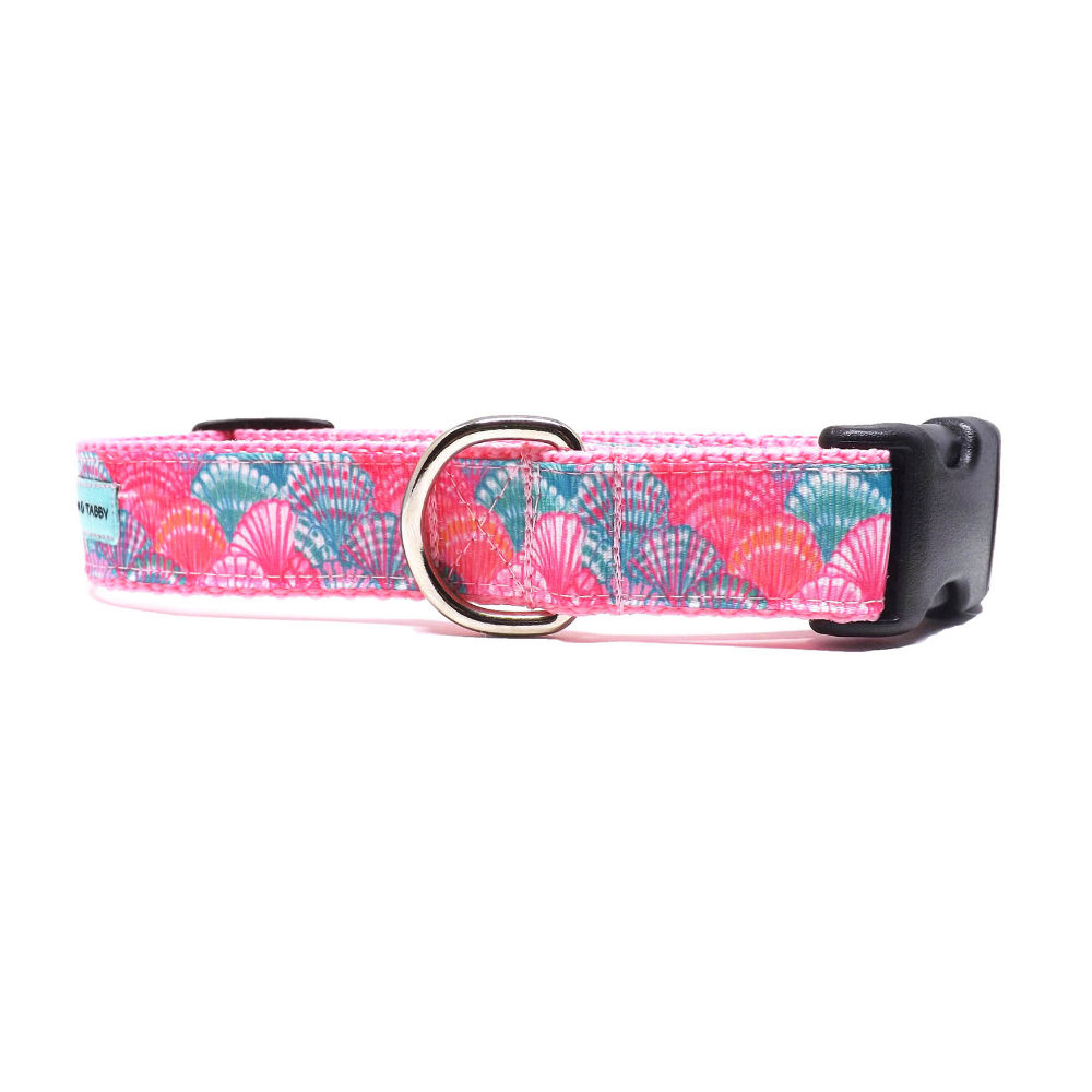 dog collar with pink and turquoise seashells overlapping, front view