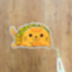 sticker of a taco shaped like a cat