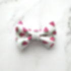 dog or cat bow tie with pink and green watermelon slices on a white background, front view