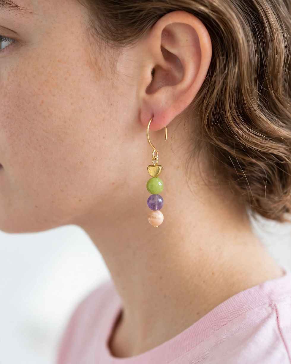 Model wearing Jade Amethyst Sunstone gold heart gemstone earrings