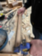 Bench leg piece secure with the wood clamp, before chiseling