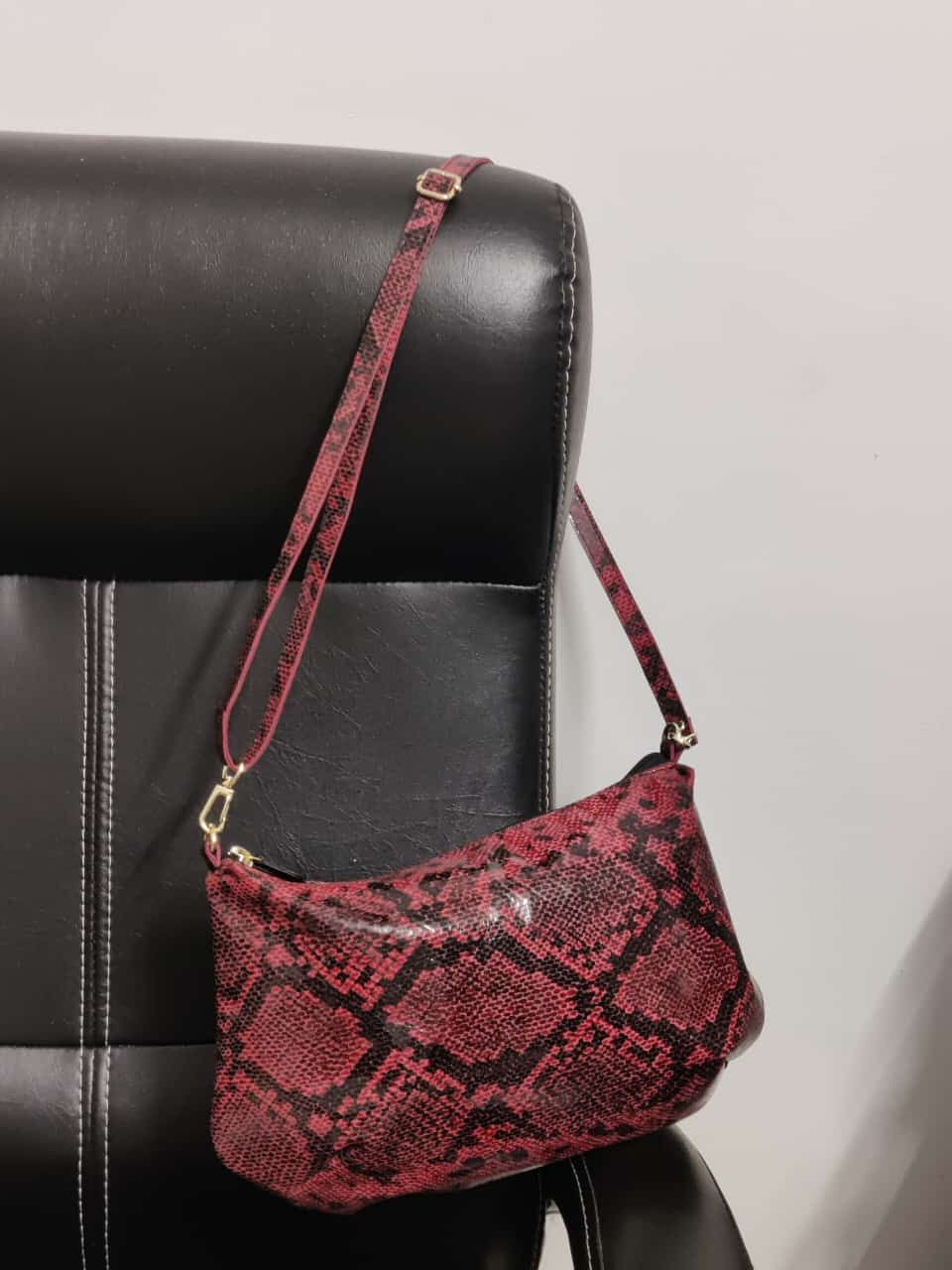 leather bag for ladies in pink snakes skin