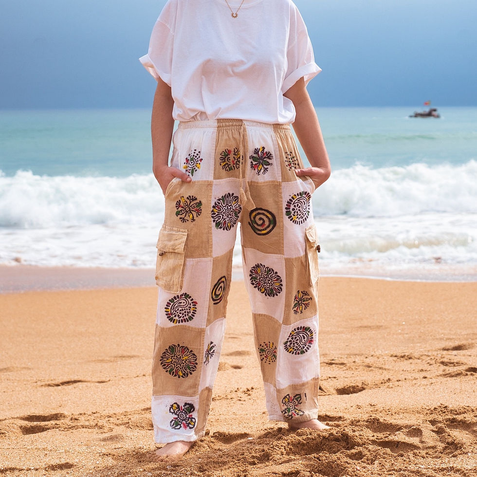 Flowing patchwork trousers, relaxed drape.