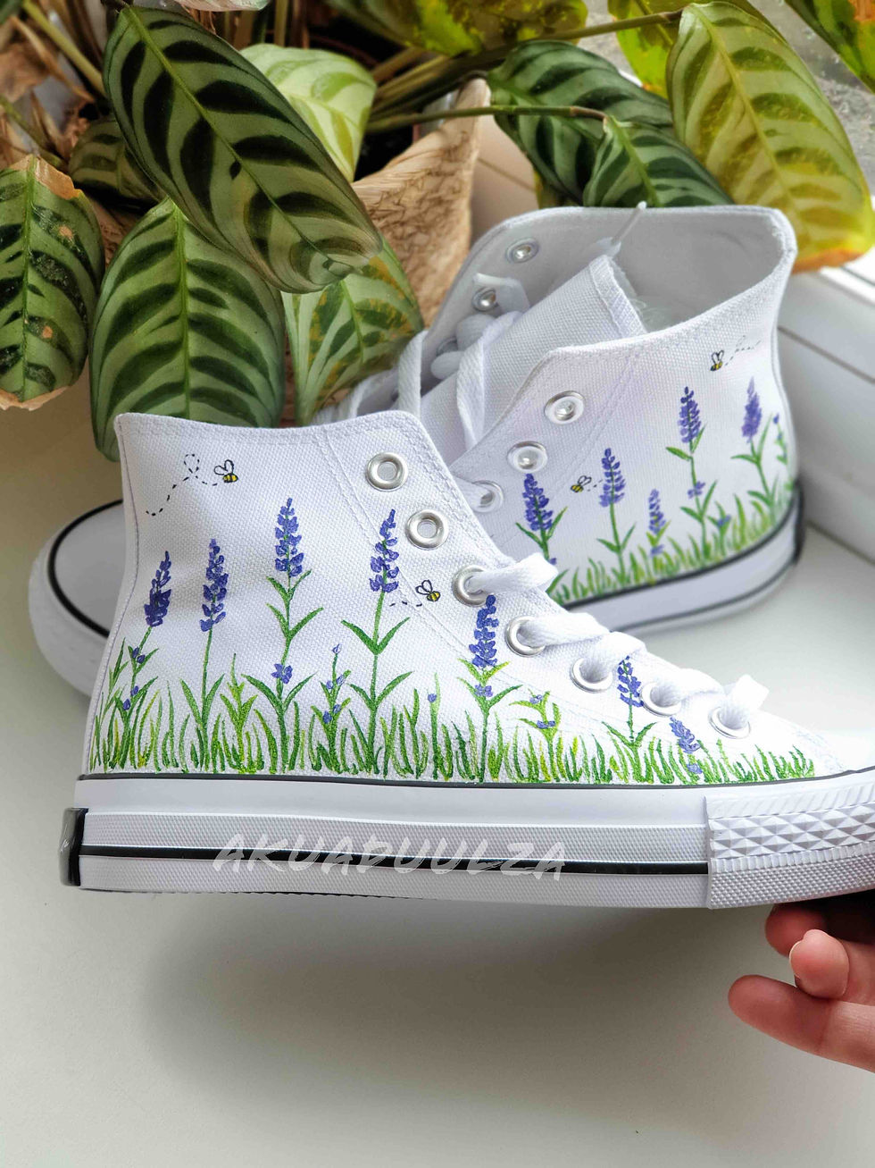 Thumbnail: White high-top canvas shoes with handpainted lavender and bees, facing right.
