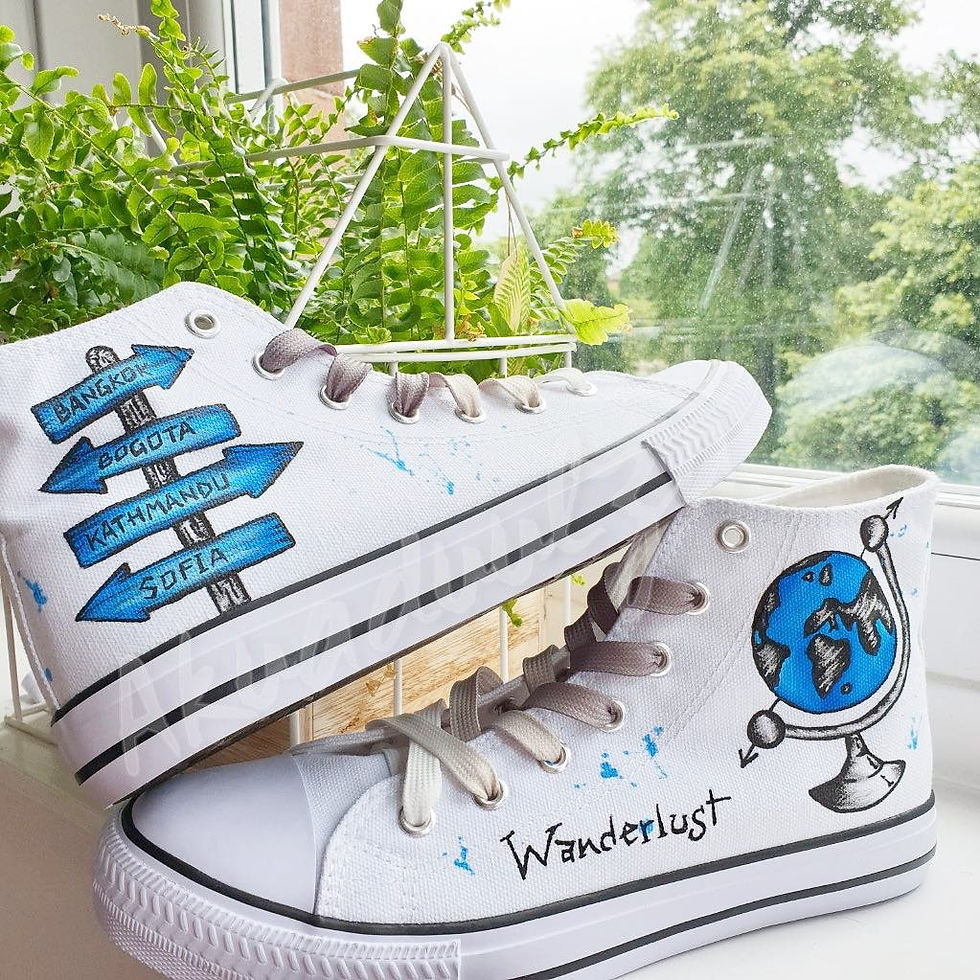 Thumbnail: White high-top canvas shoes with handpainted Wanderlust, placed top of each other.