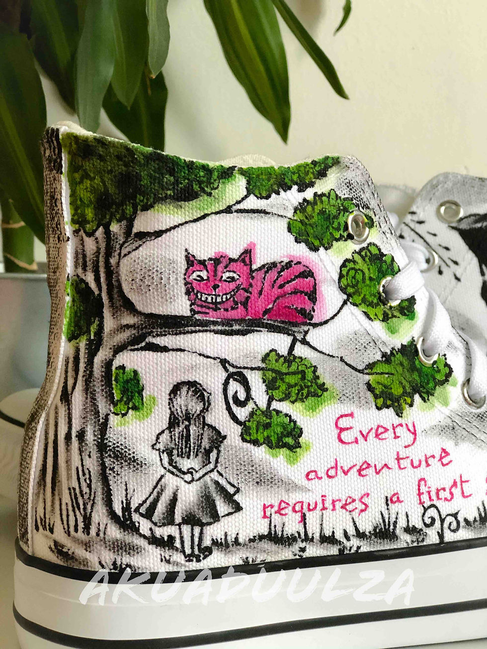 Thumbnail: Close-up of handpainted Alice in Wonderland details on white canvas shoe, intricate.