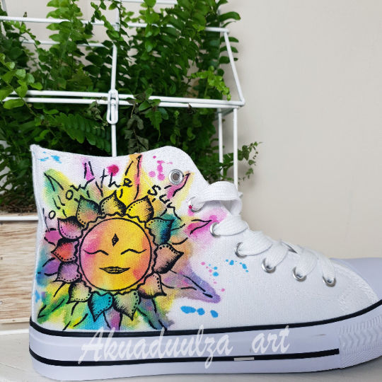 Thumbnail: White high-top canvas shoes with handpainted Hippie Sun, facing right.