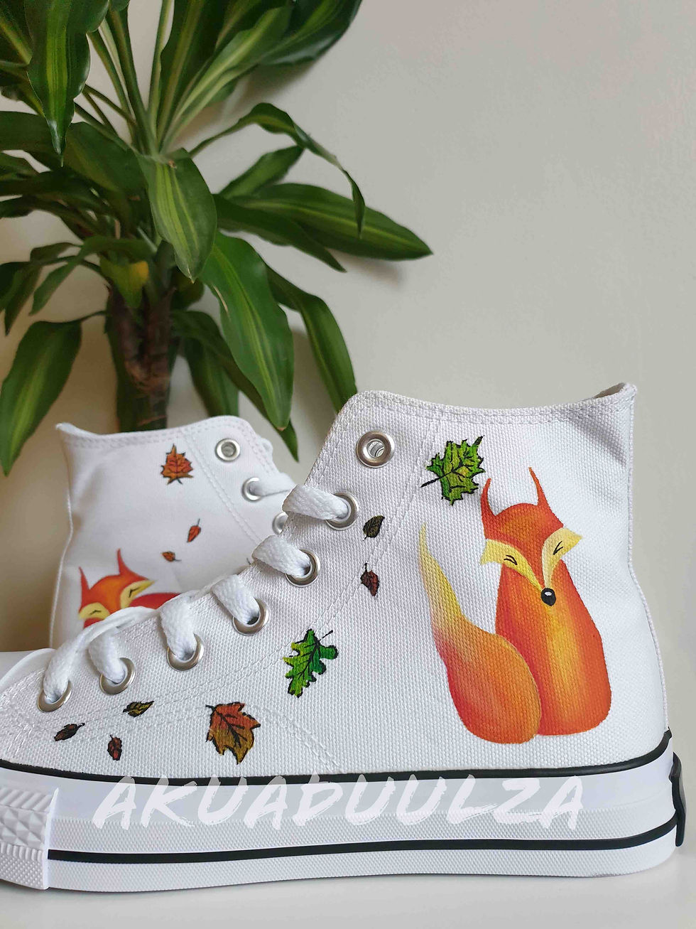 Thumbnail: White high-top canvas shoes with handpainted fox, facing left.