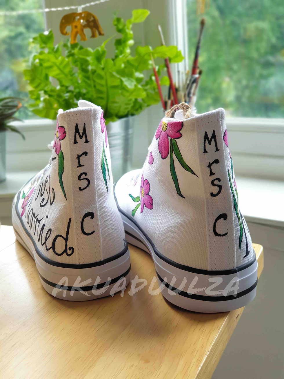 Thumbnail: White high-top canvas shoes with handpainted 'just married' text and pink flower, showing back view.