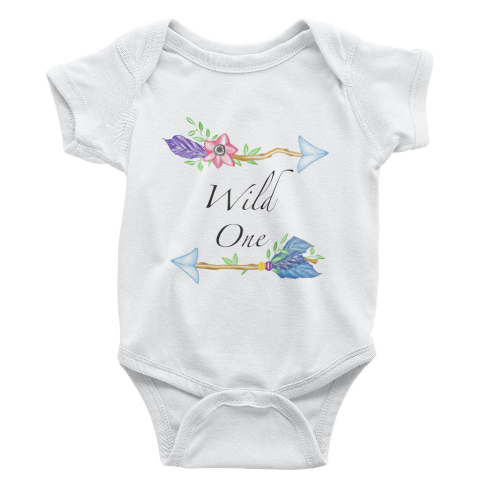 White baby bodysuit with "Wild One" and arrow graphic, laid flat.