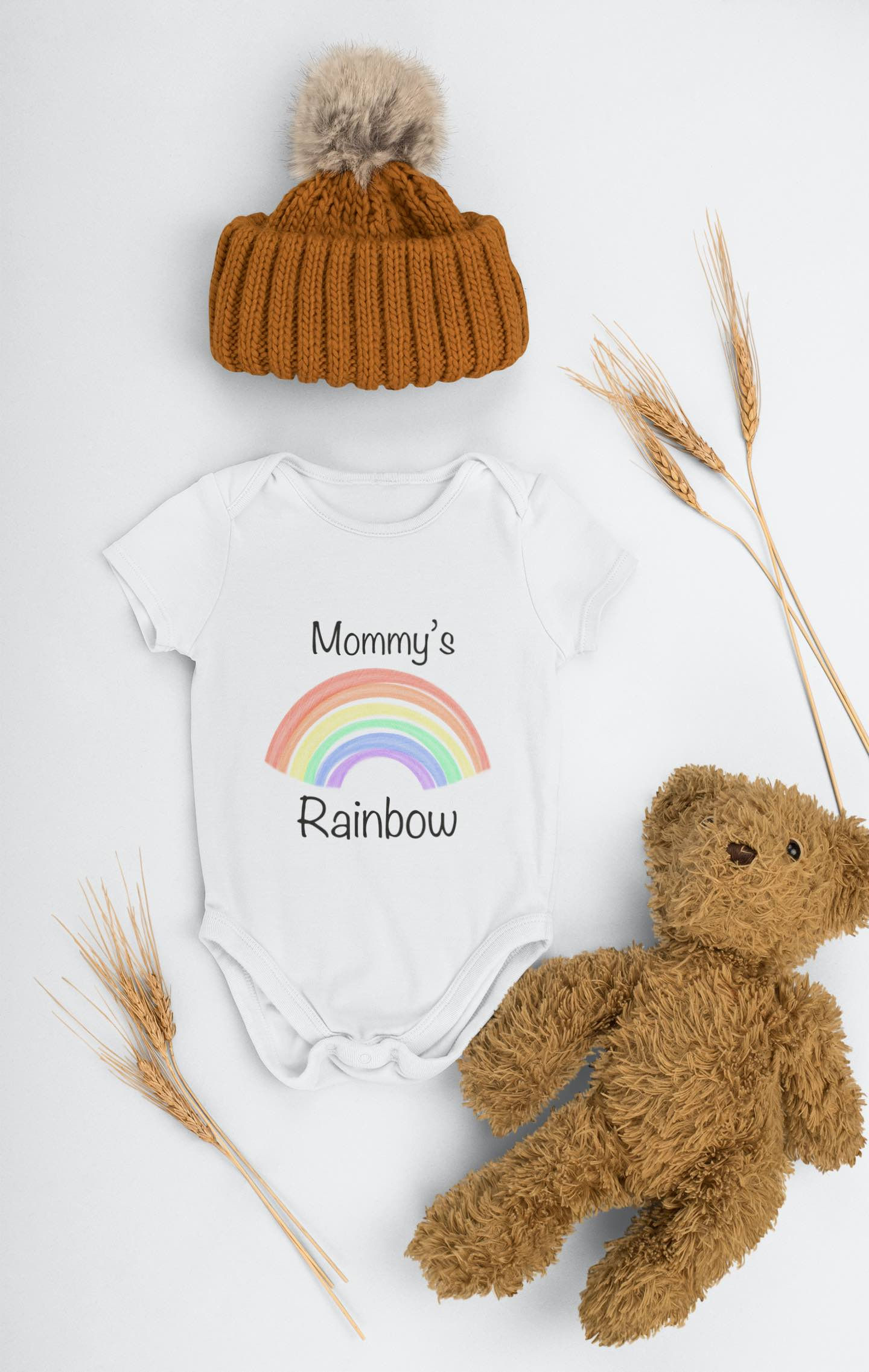 White baby bodysuit, "Mommy's Rainbow" with rainbow graphic, teddy bear and wheat