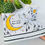 Thumbnail: White high-top canvas shoes with handpainted Celestial designs, facing right.