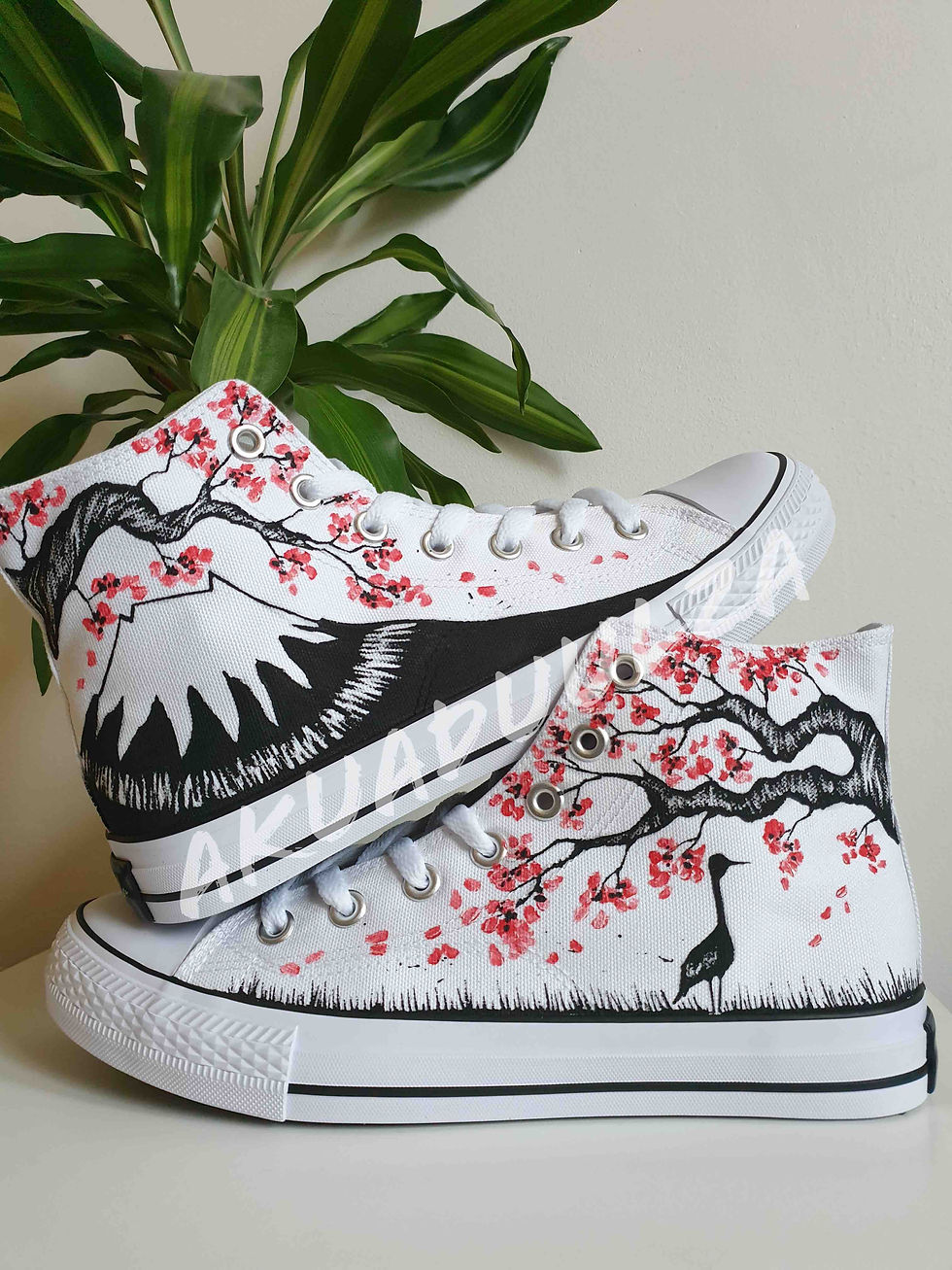 Thumbnail: White high-top canvas shoes with handpainted Cherry blossom and Mount Fuji, placed top of each other.