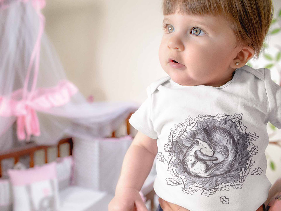 Thumbnail: Baby in white bodysuit with Squirrel graphic, looking towards the right.