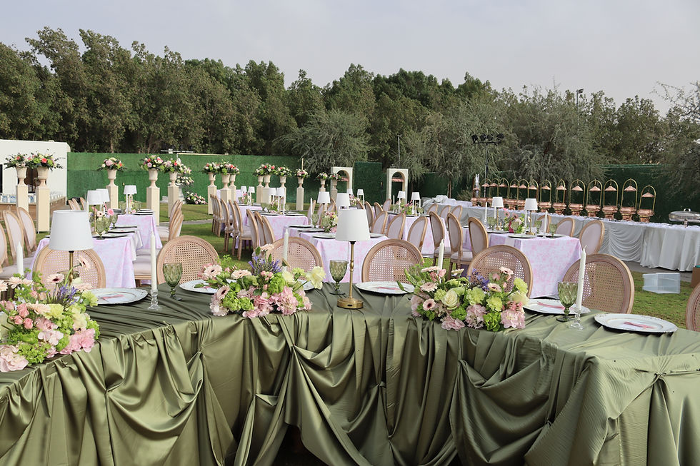 High angle view of a desert wedding setup under the stars with elegant lighting and seating arrangements
