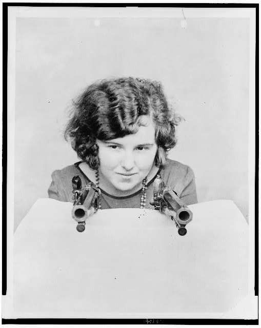 Miss Grace Stockman with President Andrew Jackson’s dueling pistols, at the National Museum. Photographic print. (Created 1926). Library of Congress Prints and Photographs Division