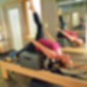 Client on the Pilates Reformer and short box