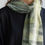 Thumbnail: Cotton scarf featuring abstract pond-inspired greens and grays, softly draped around the neck.