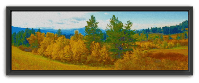 Vibrant autumn landscape with golden trees, green hills, and distant blue mountains, set in a black frame.