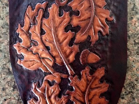 A carved leather knife sheath