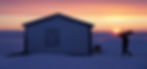A man, only visible as a silhouette carries a woodpalet on his shoulders towards a cabin