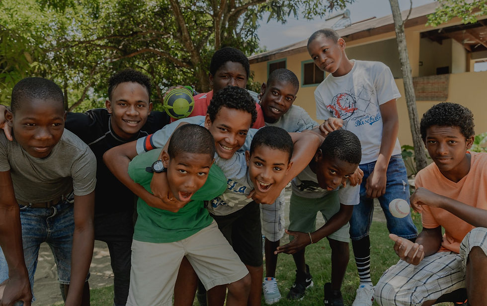 Group of boys hugging and smiling