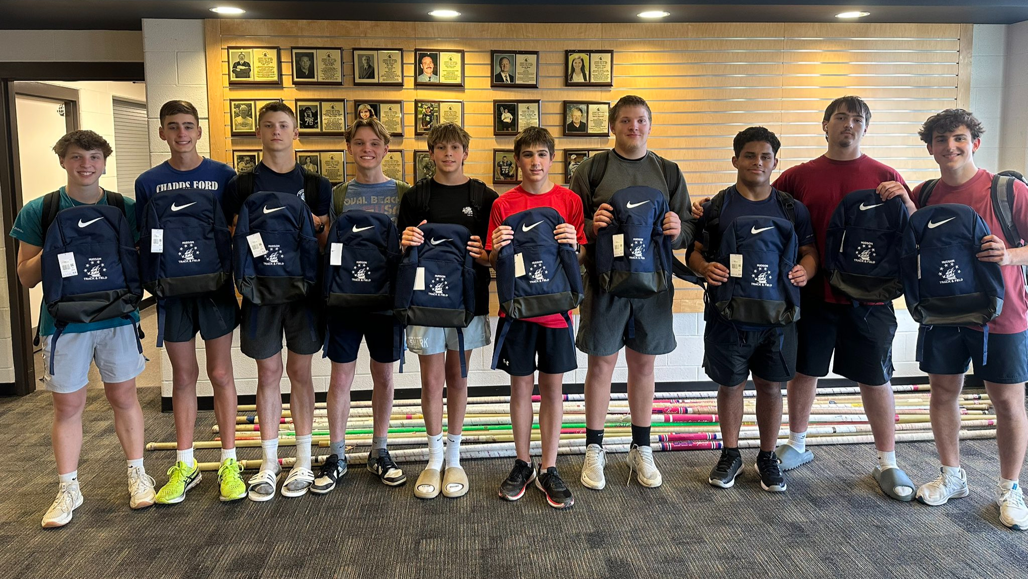 Hudson Track and Field showing off their Nike Backpacks earned through their Gold Athletics Fundraiser.